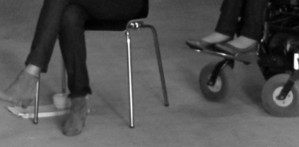 feets_and_wheels_of_a_wheelchair_photo_KB